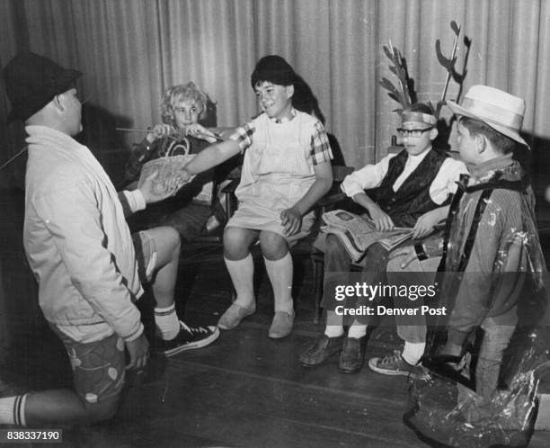 Manning Junior High in Melodrama "Will you marry me?" Mike Kilgore asks the "fair maid" in pigtails who is really Kent Kovarik, .12, son of Mr. And...