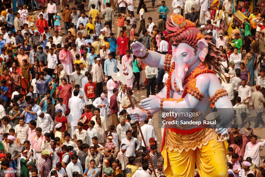 Devotees carry Ganesh Idol for immersion