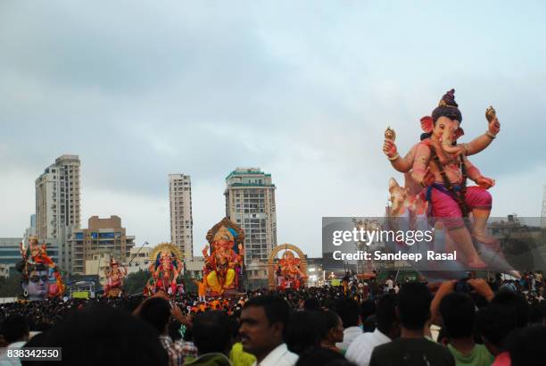 ganesh idol linedup for immersion - ganesh chaturthi stock pictures, royalty-free photos & images