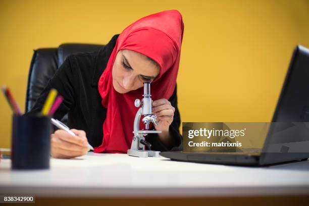 muslim science working - religious veil stock pictures, royalty-free photos & images