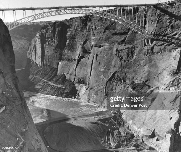Glen Canyon Dam & Reservoir - 1960 This view looks downstream under the $5 million Glen Canyon Bridge, world's largest steel arch span, dedicated in...