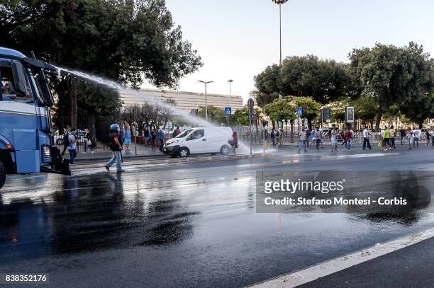 The police use water cannons to remove refugees who camped in Piazza Indipendenza Gardens after their eviction from an occupied building in Piazza...