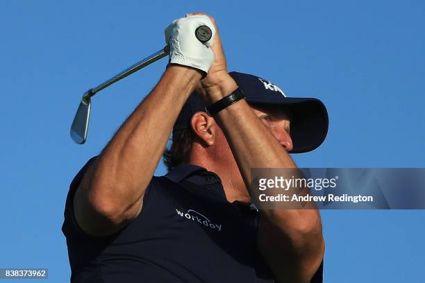 Phil Mickelson of the United States plays his shot from the 11th tee during round one of The Northern Trust at Glen Oaks Club on August 24, 2017 in...