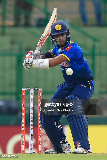 Sri Lankan cricketer Kusal Mendis watches the ball as he plays a shot during the 2nd One Day International cricket match between Sri Lanka and India...