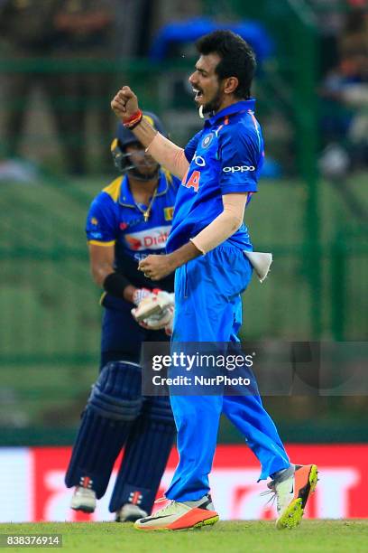 Indian cricketer Yuzvendra Chahal celebrates after taking the wicket of Sri Lanka's Kusal Mendis during the 2nd One Day International cricket match...