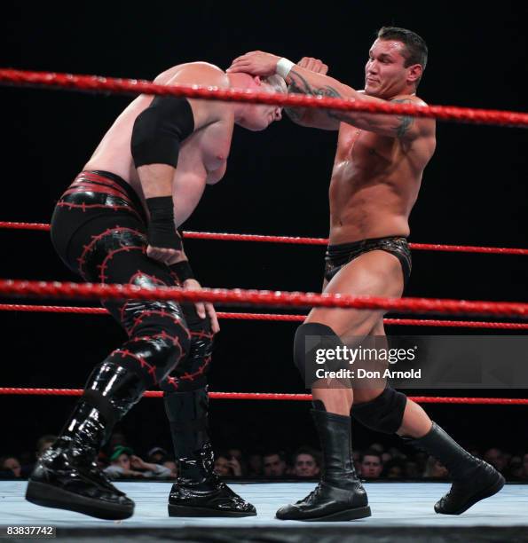 Randy Orton directs his energies towards the bald pate of Kane during the WWE RAW Superslam event at Acer Arena, Homebush Stadium in Sydney on August...