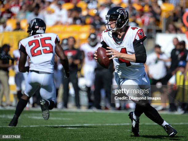 Quarterback Matt Simms of the Atlanta Falcons turns to throw a pass in the first quarter of a preseason game on August 20, 2017 against the...