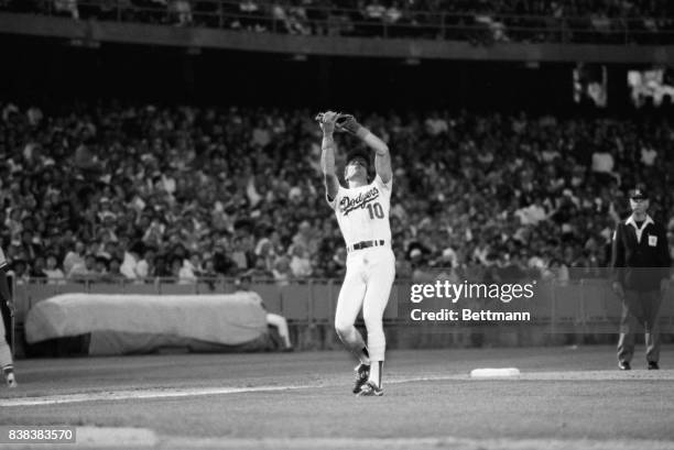 Reggie Williams catches ball in the outfield.