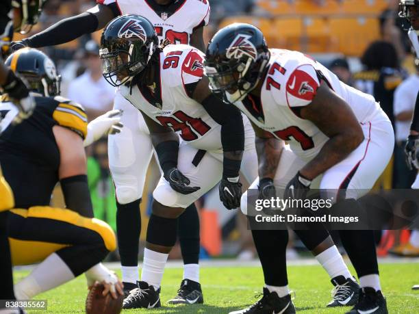 Defensive tackle Courtney Upshaw of the Atlanta Falcons awaits the snap from his position in the second quarter of a preseason game on August 20,...