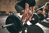 Strong man doing deadlift training in gym