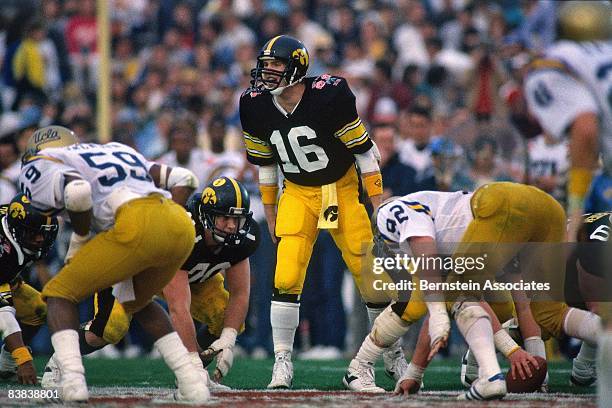 Chuck Long of the Iowa Hawkeyes call a play against the UCLA Bruins during the football game in January 1987 at the Rose Bowl, Pasadena, California.