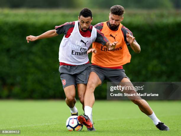 Francis Coquelin and Olivier Giroud of Arsenal during a training session at London Colney on August 24, 2017 in St Albans, England.