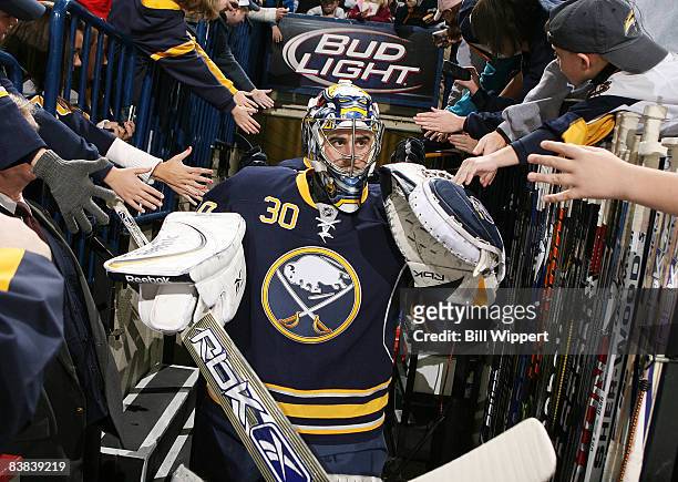 Ryan Miller of the Buffalo Sabres wears the team's new third jersey as he heads to the ice to play the Boston Bruins on November 26, 2008 at HSBC...
