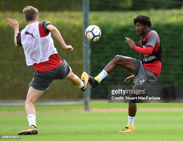 Rob Holding and Ainsley Maitland-Niles of Arsenal during a training session at London Colney on August 24, 2017 in St Albans, England.