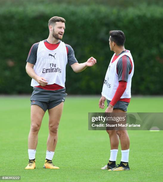 Shkodran Mustafi and Alexis Sanchez of Arsenal during a training session at London Colney on August 24, 2017 in St Albans, England.