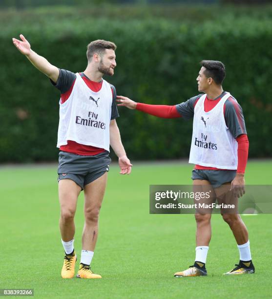 Shkodran Mustafi and Alexis Sanchez of Arsenal during a training session at London Colney on August 24, 2017 in St Albans, England.