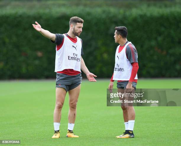 Shkodran Mustafi and Alexis Sanchez of Arsenal during a training session at London Colney on August 24, 2017 in St Albans, England.