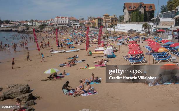 Beachgoers crowd Praia da Duquesa on August 23, 2017 in Cascais, Portugal. Many beaches are one of many attractions the country offers to tourism....