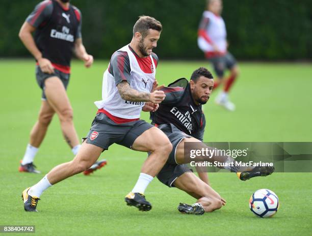 Jack Wilshere and Francis Coquelin of Arsenal during a training session at London Colney on August 24, 2017 in St Albans, England.