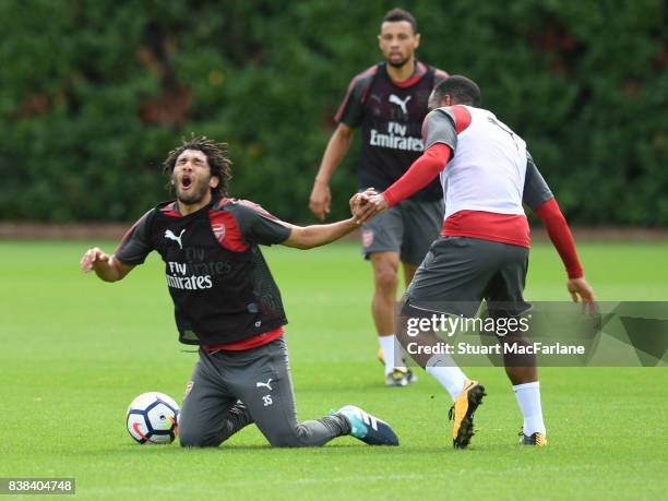 Mohamed Elneny and Alex Lacazette of Arsenal during a training session at London Colney on August 24, 2017 in St Albans, England.