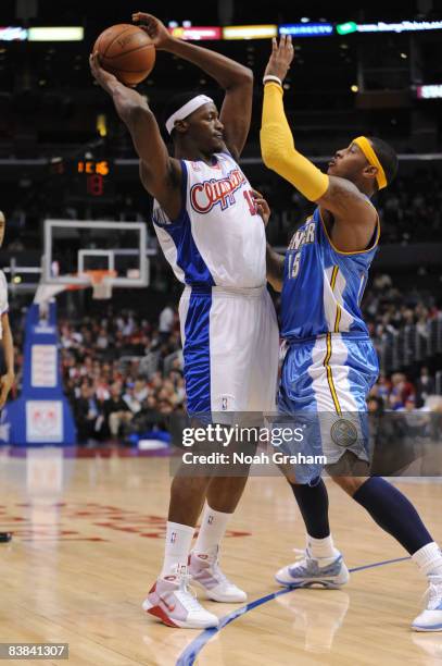Al Thornton of the Los Angeles Clippers is guarded by Carmelo Anthony of the Denver Nuggets at Staples Center on November 26, 2008 in Los Angeles,...