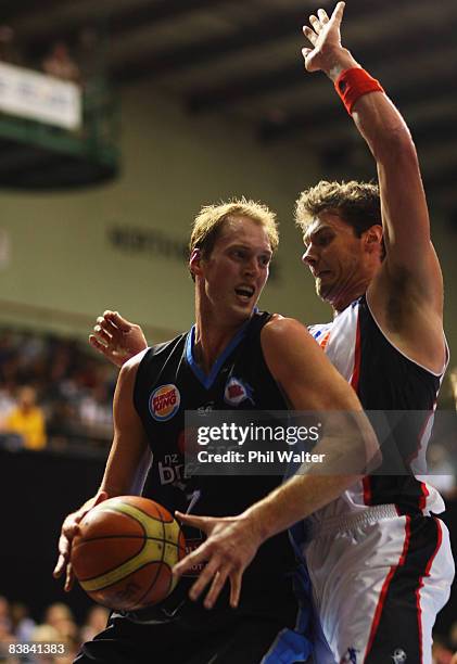 Rick Rickert of the New Zealand Breakers has his path blocked by Alex Loughton of the Perth Wildcats during the round 11 NBL match between the New...