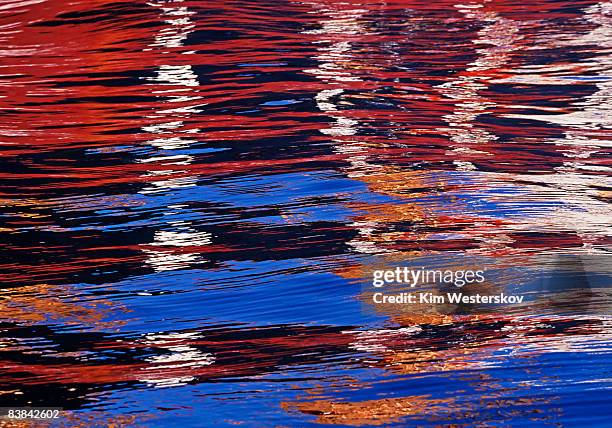 harbour reflections of cargo ships and blue sky - westerskov stock pictures, royalty-free photos & images