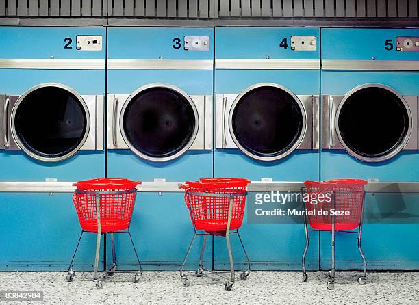driers at laundromat - laundry fotografías e imágenes de stock