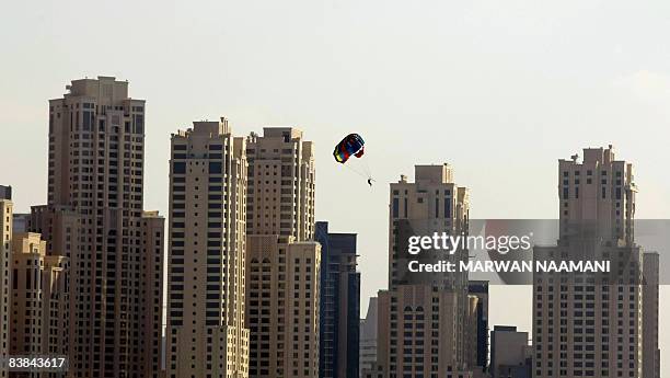 Picture taken from the sea shows skyscrapers of the Jumeirah Beach Residence in Dubai on November 26, 2008. AFP PHOTO/MARWAN NAAMANI