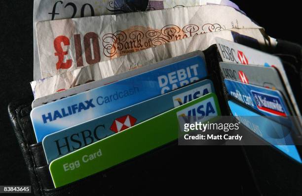 In this photo illustration a wallet open to show credit cards and cash on November 27 2008 in Bristol, England. Many UK consumers are feeling the...