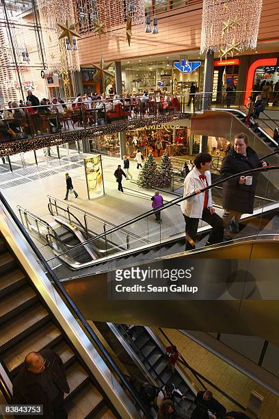 Shoppers walk among Christmas decorations at the Arkaden shopping mall on November 27, 2008 in Berlin, Germany. German retailers are hoping for...