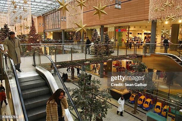 Shoppers walk among Christmas decorations at the Arkaden shopping mall on November 27, 2008 in Berlin, Germany. German retailers are hoping for...