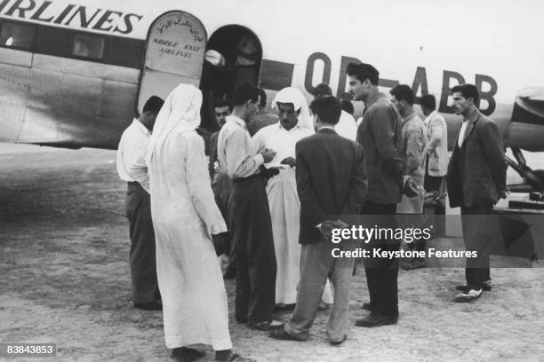 Prince Ali, son of Sheikh Ali bin Abdullah Al-Thani, prepares to travel aboard on business, taking an MEA aircraft from Qatar, September 1953.