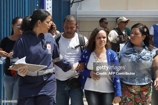 Survivor from a boat wreck, after a ferry sank off the northeastern state of Bahia, arrives at the Maritime Terminal of Salvador, Bahia State, on...