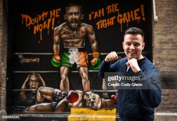 Dublin , Ireland - 24 August 2017; Oisín Hand, a long-time Conor McGregor supporter from Balbriggan, Dublin, pictured in front of a mural of Conor...