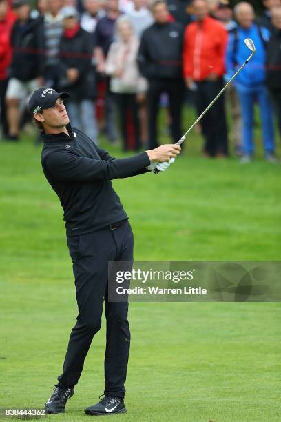 Thomas Pieters of Belgium hits his second shot on the 1st hole during day one of Made in Denmark at Himmerland Golf & Spa Resort on August 24, 2017...
