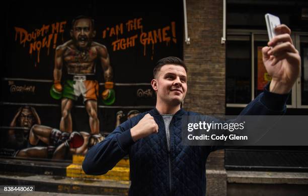 Dublin , Ireland - 24 August 2017; Oisín Hand, a long-time Conor McGregor supporter from Balbriggan, Dublin, pictured in front of a mural of Conor...