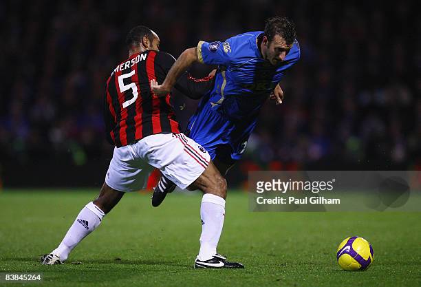 Glen Little of Portsmouth is challenged by Emerson of AC Milan during the UEFA Cup Group E match between Portsmouth and AC Milan at Fratton Park on...