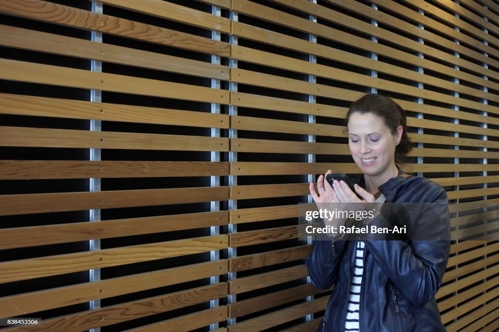 Woman text messaging on a mobile