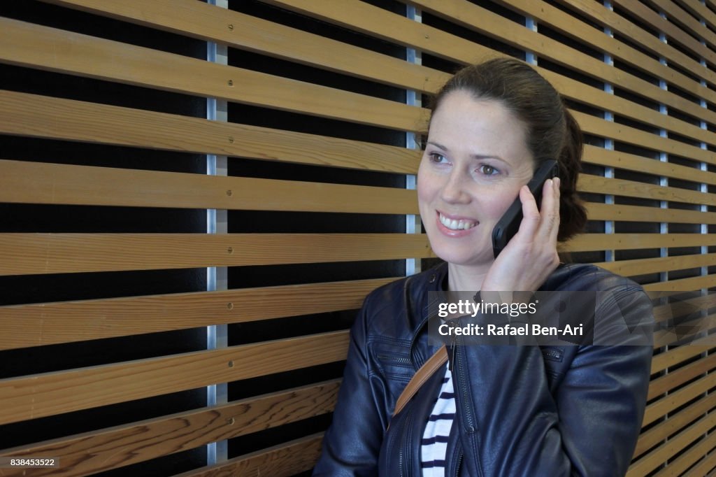 Woman speaks on a mobile phone