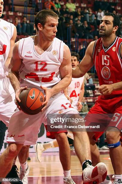 Richard Mason Rocca, #12 of AJ Milano competes with Giannis Giannoulis, #15 of Panionios On Telecoms during the Euroleague Basketball Game 5 match...