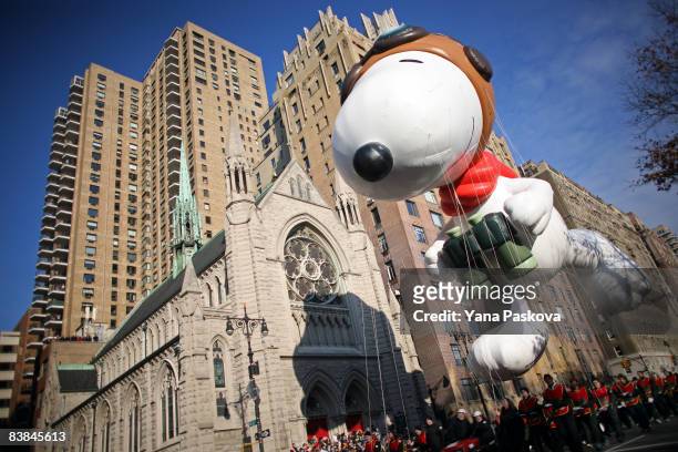Parade participants guide a Snoopy float at the annual Macy's Thanksgiving Day Parade on November 27, 2008 in New York City.