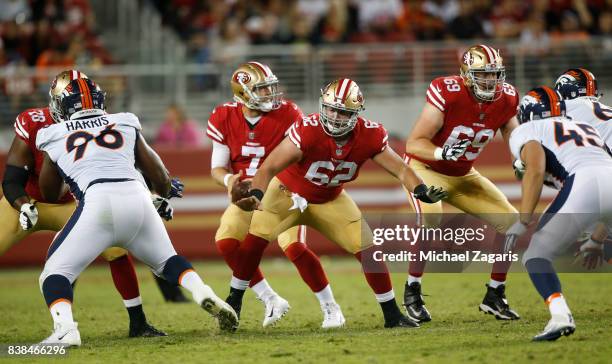 Erik Magnuson and Andrew Gardner#69 of the San Francisco 49ers block for Matt Barkley during the game against the Denver Broncos at Levi Stadium on...