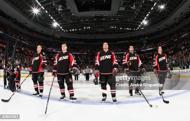 Jarkko Ruutu, Anton Volchenkov, Mike Fisher, Chris Phillips and Shean Donovan of the Ottawa Senators stand at the blue line during the singing of the...