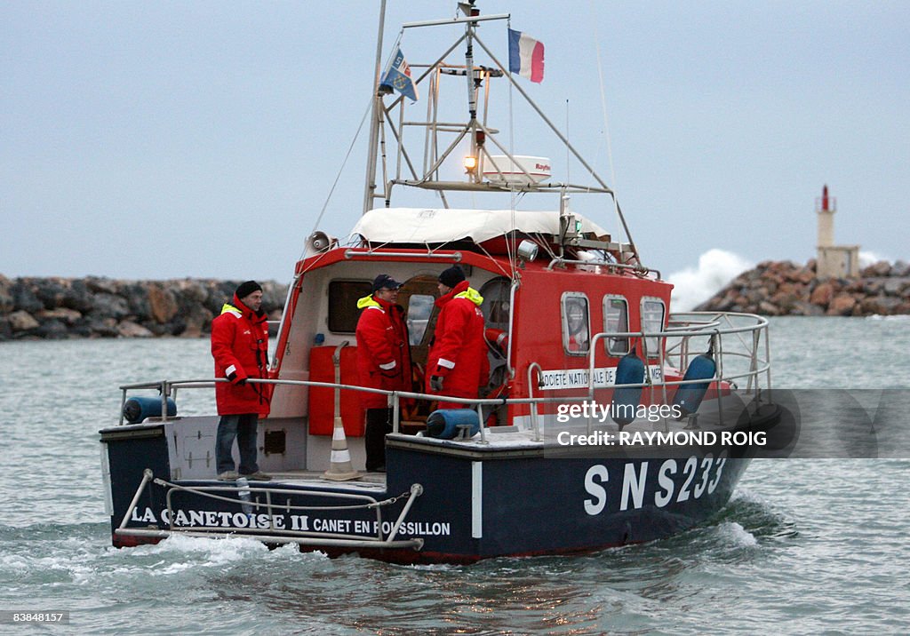 Freedom French Rescue French rescue workers stand on a boat scouring the seas, on November ...