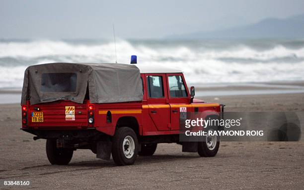 Vehicule belonging to the French firefighters drives on the beach as part of a rescue operation, on November 28 in Perpignan, southern France, after...