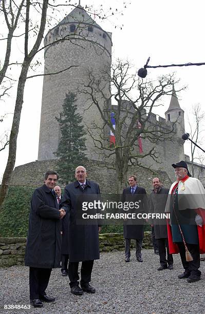 Swiss President Pascal Couchepin shakes hands with French Prime Minister François Fillon before an official working meeting at the Lucens Castel on...