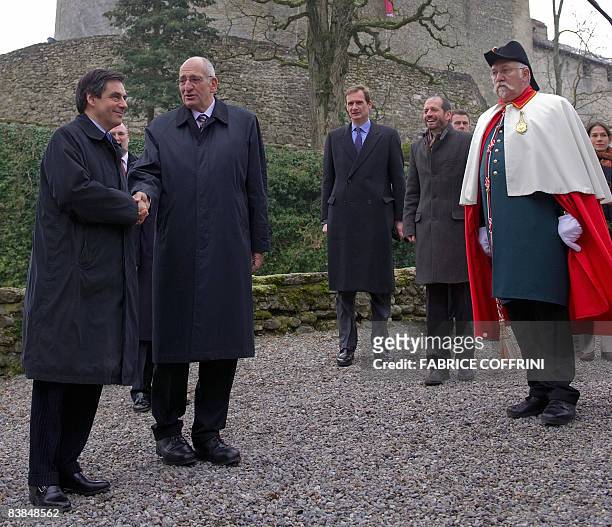 Swiss President Pascal Couchepin shakes hands with French Prime Minister François Fillon before an official working meeting at Lucens Castel on...
