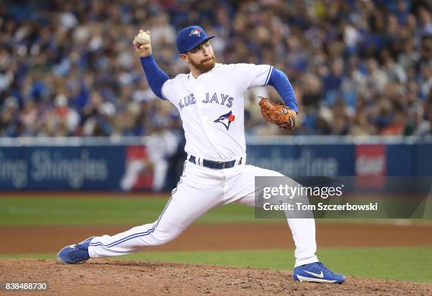 Danny Barnes of the Toronto Blue Jays delivers a pitch in the seventh inning during MLB game action against the New York Yankees at Rogers Centre on...