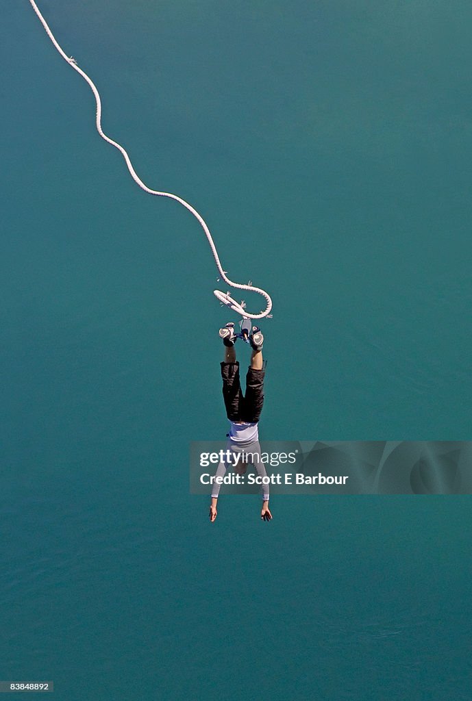 Woman bungee jumping in New Zealand.